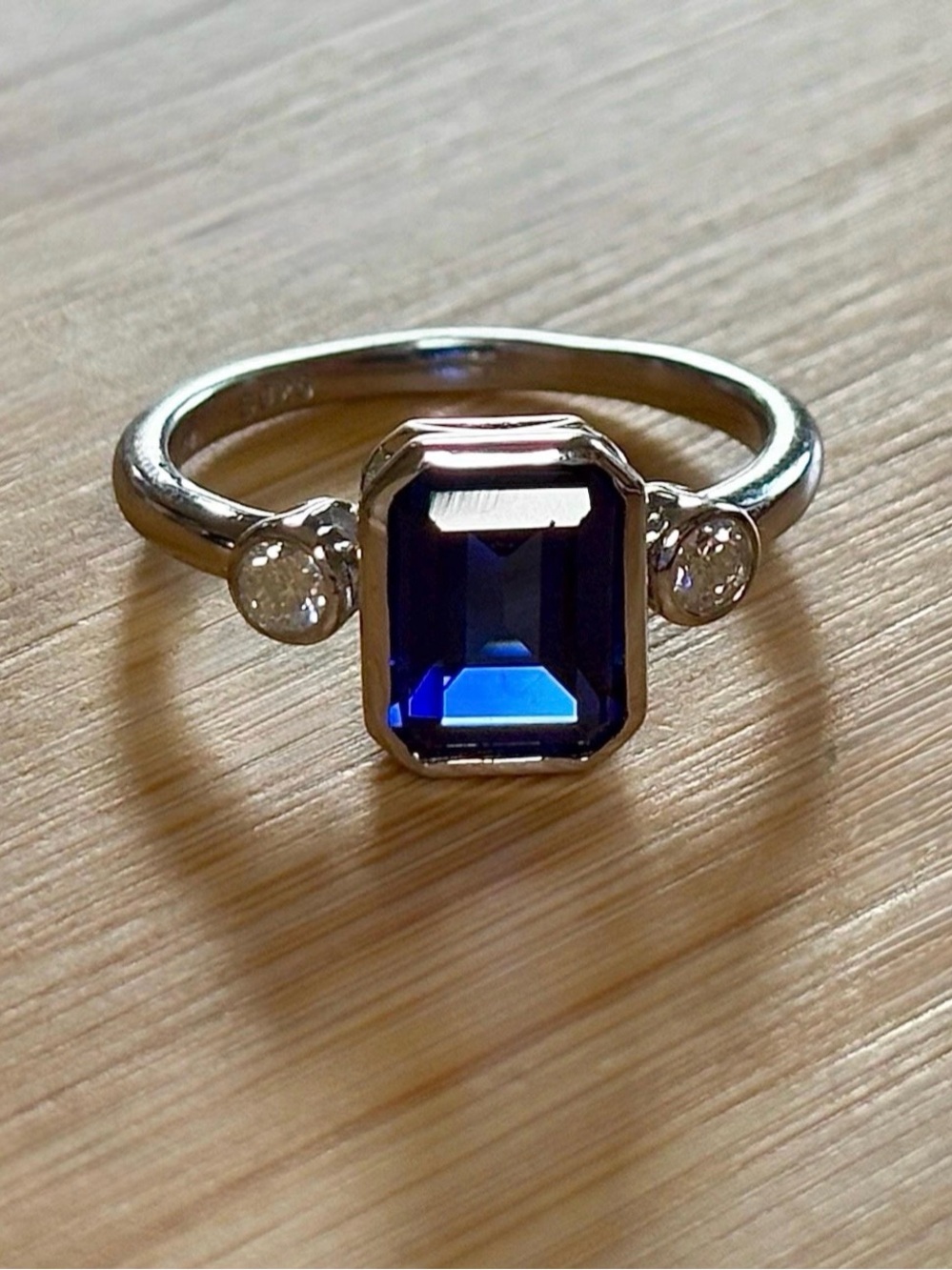 A certified 3ct lab-grown blue sapphire & .20ctw Moissanite ring, in 925 or 935!
